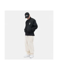 a men wear stussy surfman stadium jacket black nylon varsity bomber with whirte pant
