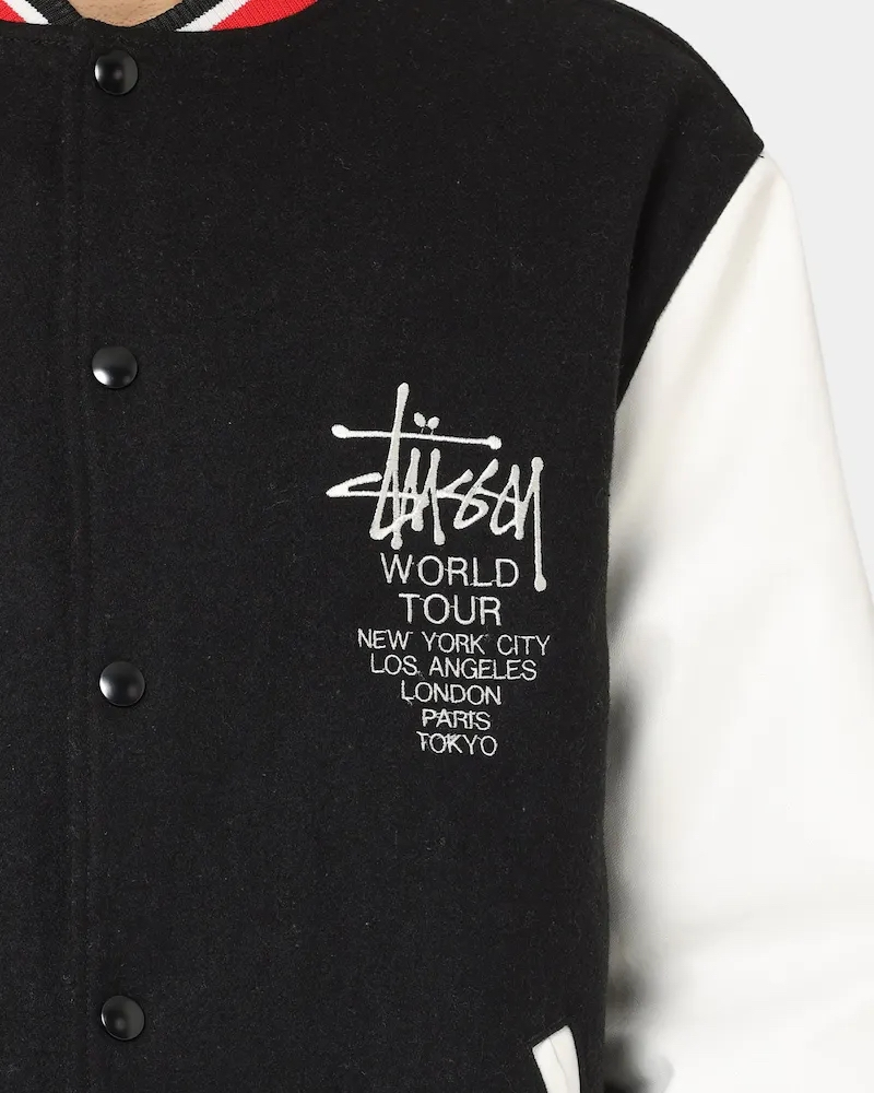 stussy world tour varsity jacket navy and white varsity jacket front closeup view