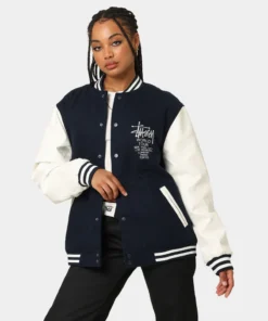 stussy world tour varsity jacket navy and white women varsity jacket front full view