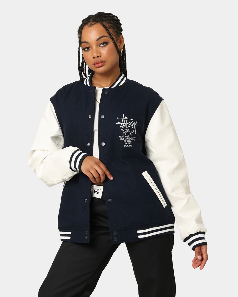 stussy world tour varsity jacket navy and white women varsity jacket front full view