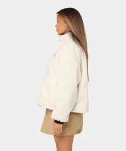 women wear a stussy reversible box fit sherpa jacket left side