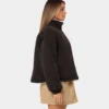 women wear a stussy reversible box fit sherpa jacket right side