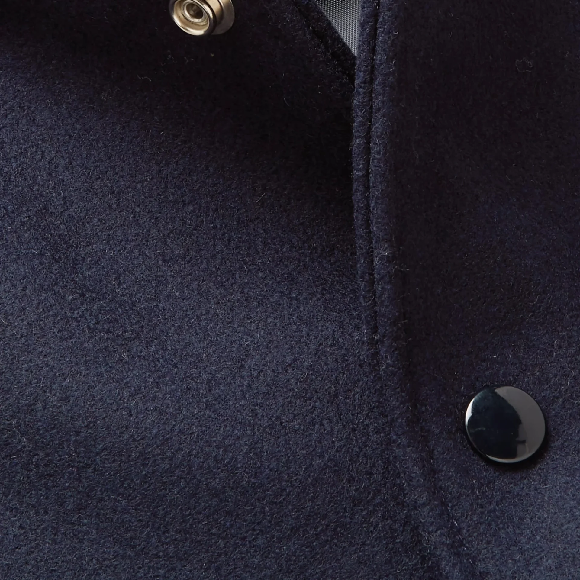 letterman style navy and white varsity bomber close up