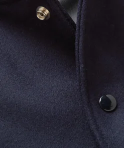 letterman style navy and white varsity bomber close up