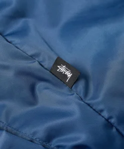 stussy blue flight satin bomber jacket closeup