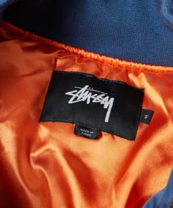 stussy blue flight satin bomber jacket tag closeup