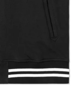 stussy full black fleece varsity jacket black and white rip closeup