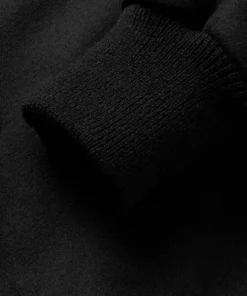stussy leather trimmed wool varsity bomber jacket closeup