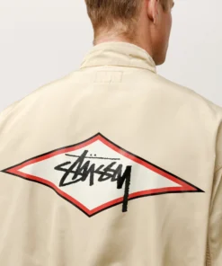 stussy surf team relaxed nylon harrington jacket light sand color logo closeup