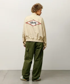 stussy surf team relaxed nylon harrington jacket light sand color women back view