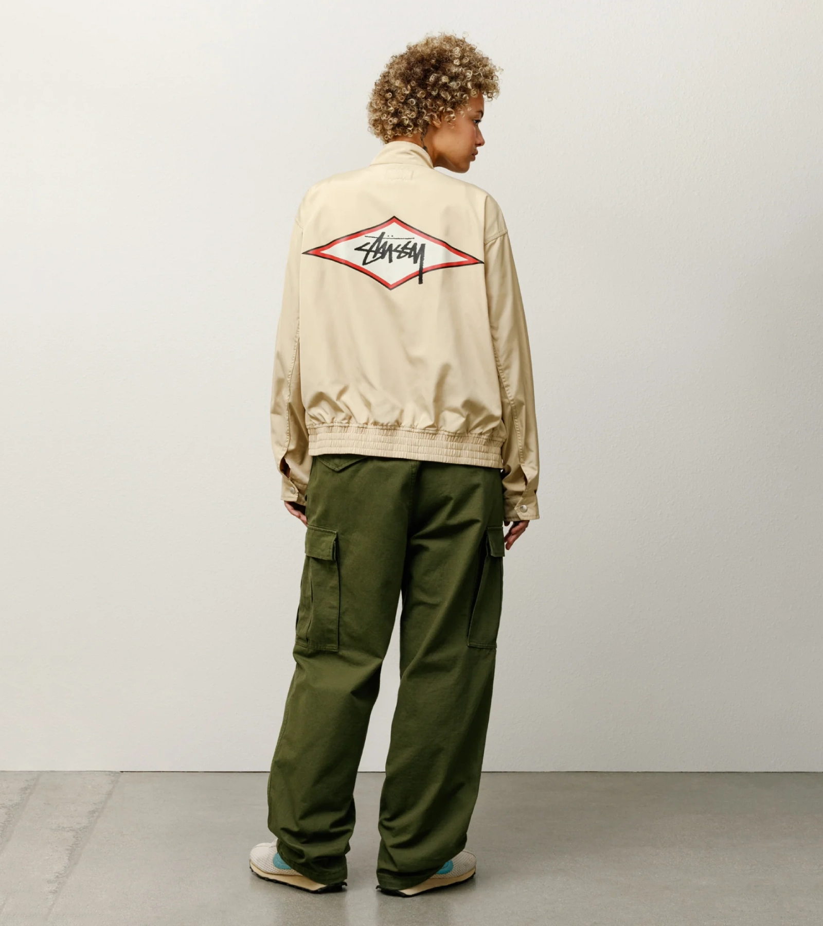 stussy surf team relaxed nylon harrington jacket light sand color women back view